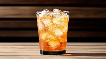 A glass of iced tea sitting on a wooden table photo