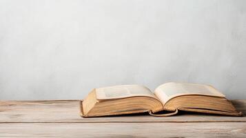 An open book on a wooden table photo