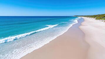 A beach with a white sand beach and blue water photo