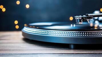 A turntable with a record player on a wooden table photo