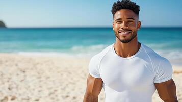 A man in a white shirt standing on the beach photo