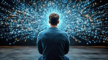 Man sitting in meditation with glowing light coming from his head photo