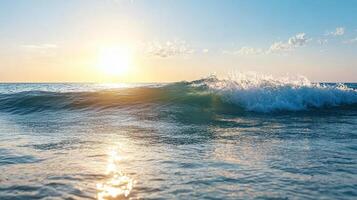 A wave breaking on the beach at sunset photo