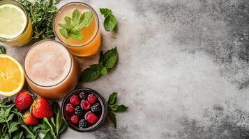 A variety of juices and fruits are arranged on a table photo