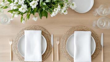 A table setting with white plates and napkins photo