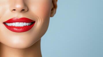 A woman with red lipstick and white teeth photo