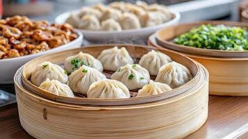 Dumplings are served in bowls on a wooden table photo