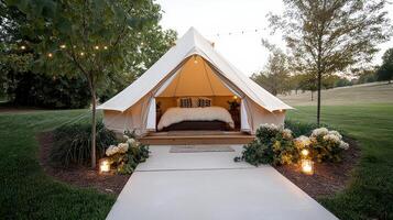 A tent with a bed and candles lit up photo