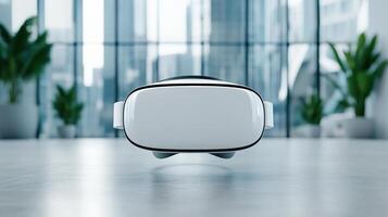 Virtual reality headset on a table in front of a window photo