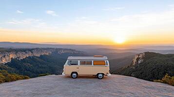 A van parked on a mountain top at sunset photo