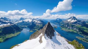 The view from the top of a mountain overlooking a lake photo