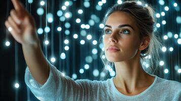 A woman is pointing at a string of lights photo