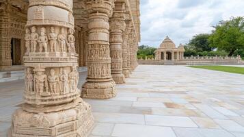 Intricately carved stone pillars support beautiful temple structure, showcasing detailed photo