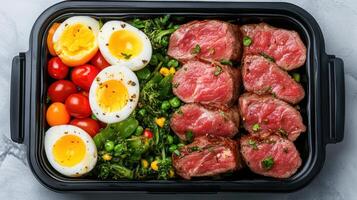 Fresh meal prep featuring lean meats, eggs, and colorful vegetables for healthy lifestyle photo