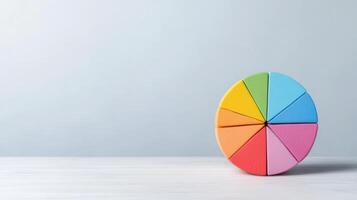 A colorful pie chart on a table photo
