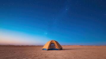 A tent in the desert at night under the stars photo