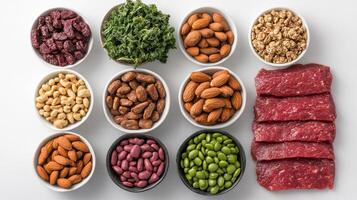 A variety of different types of meat and nuts in bowls photo