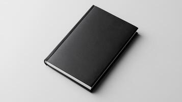 sleek black book with minimalist design, perfect for notes or journaling photo