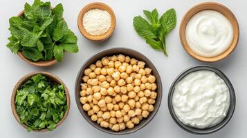 Chickpeas, herbs, and dairy create vibrant, fresh meal prep scene photo