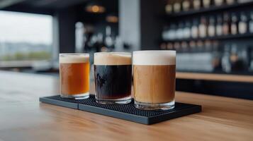 Three different types of beer are on a bar photo