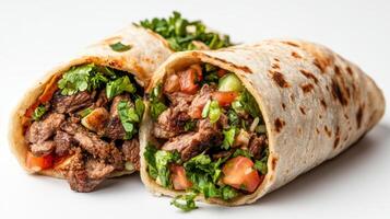 Two beef burritos cut in half on a white background photo