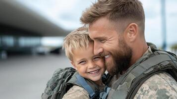 A man in military uniform holding his son photo