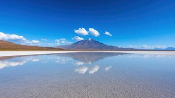 surreal salt flat reflecting sky and mountains creates breathtaking view photo