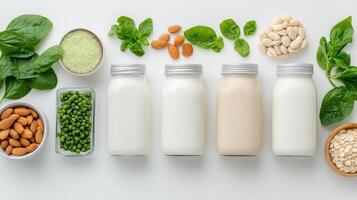 Various types of dairy products including milk, cheese, nuts and spinach photo