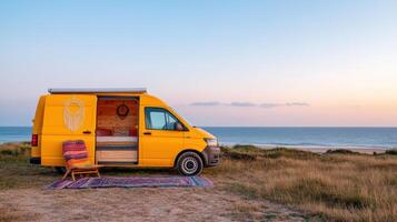 cozy van parked by sea, offering serene view of horizon at sunset photo