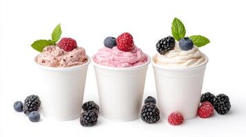 Delicious frozen yogurt cups topped with fresh berries and mint leaves photo