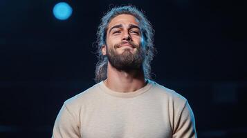 A man with a beard and a beard is smiling photo