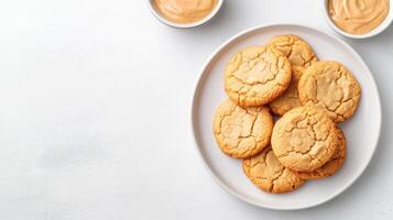 A plate of cookies with peanut butter on it photo