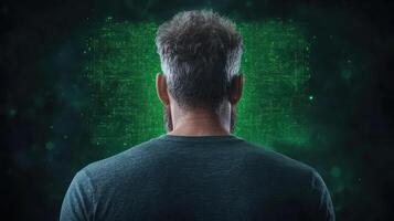 man with gray hair stands facing digital green background, evoking sense of mystery photo