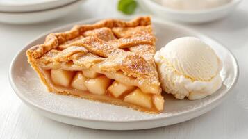 A slice of apple pie with ice cream on a plate photo