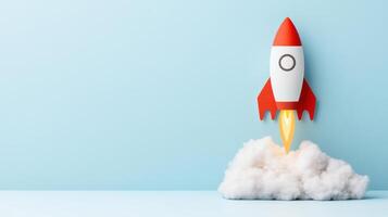 colorful rocket launching from cloud against light blue background, symbolizing innovation photo
