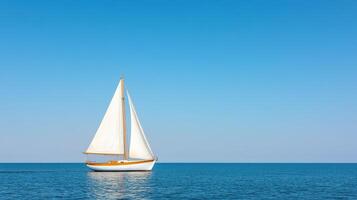 serene sailboat glides across calm waters under clear blue sky, evoking tranquility photo