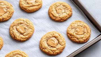 Freshly baked cookies with creamy swirl on top, perfect for sweet treat photo