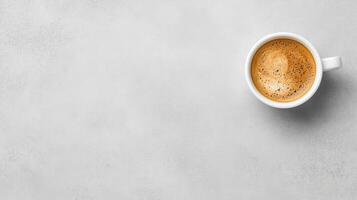 warm cup of coffee sits on smooth, light gray surface, inviting relaxation and comfort photo