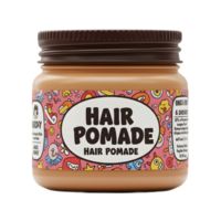 A light brown jar of hair pomade features a vibrant pink label adorned with fun, quirky cartoon characters and a playful font. The overall mood is cheerful and lighthearted. png