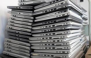 Electronic waste - pile of laptops to be discarded photo