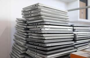 E-waste - pile of laptops to be discarded photo
