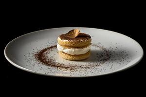 A dessert on a white plate with chocolate and sprinkles photo