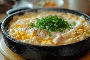 A bowl of food with a green garnish on top photo