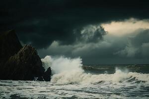 Stormy sea with waves crashing against rocks photo