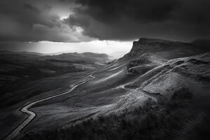 Black and white photograph of a winding road in the mountains photo