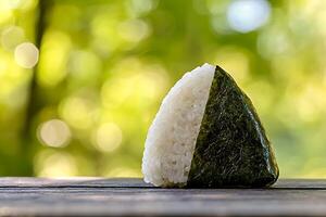 A piece of rice on a table photo