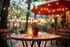 A table with a vase of flowers and a jar of jam photo