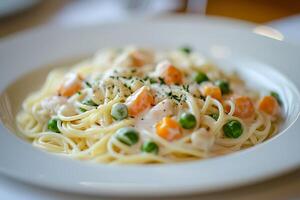 Creamy Pasta with Carrots and Peas A Close-Up of a Delicious Dish. photo
