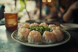 Delicious Shrimp Dumplings Garnished with Chopped Green Onions on a Plate. photo