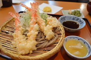 Delicious Tempura Shrimp and Buckwheat Noodles A Japanese Culinary Delight. photo